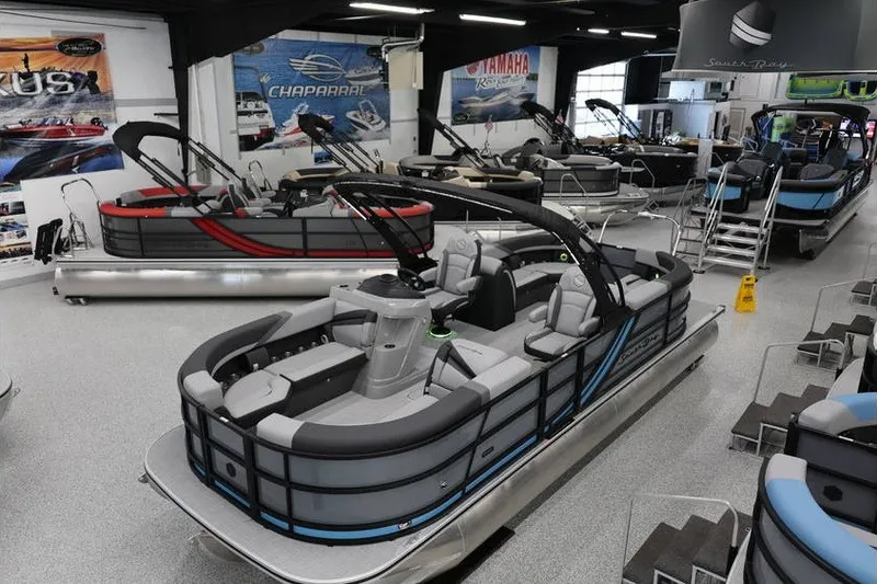 The Image of 2026 South Bay 224 RS 2.75 Hybrid Arch pontoon boat displayed in showroom. - 1