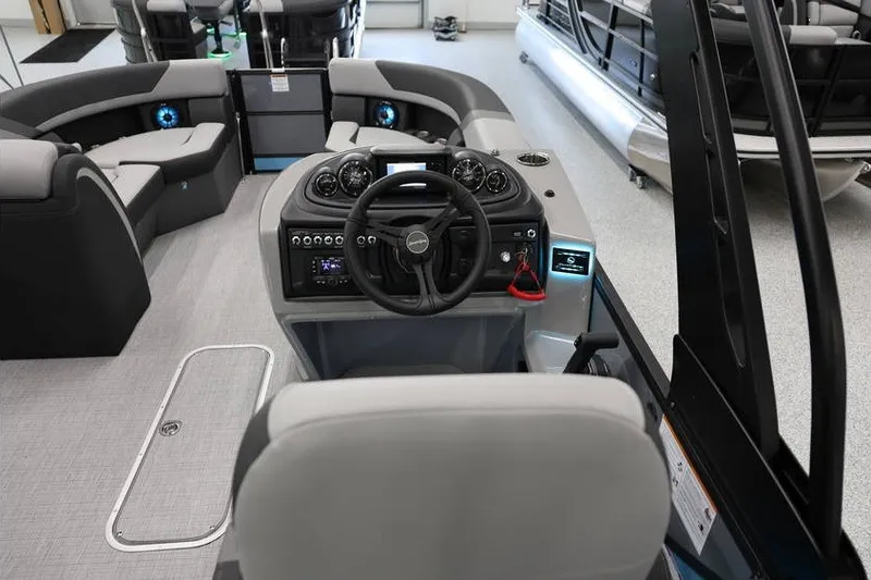 Slide: The Image of Interior view of 2026 South Bay 224 RS 2.75 Hybrid Arch boat, featuring modern helm and seating. - 11