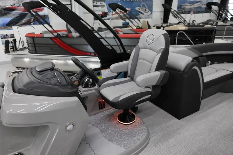 Slide: The Image of 2026 South Bay 224 RS 2.75 Hybrid Arch boat interior with modern captain's chair. - 13