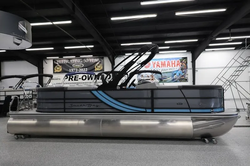 Slide: The Image of 2026 South Bay 224 RS 2.75 Hybrid Arch pontoon boat in showroom setting. - 7