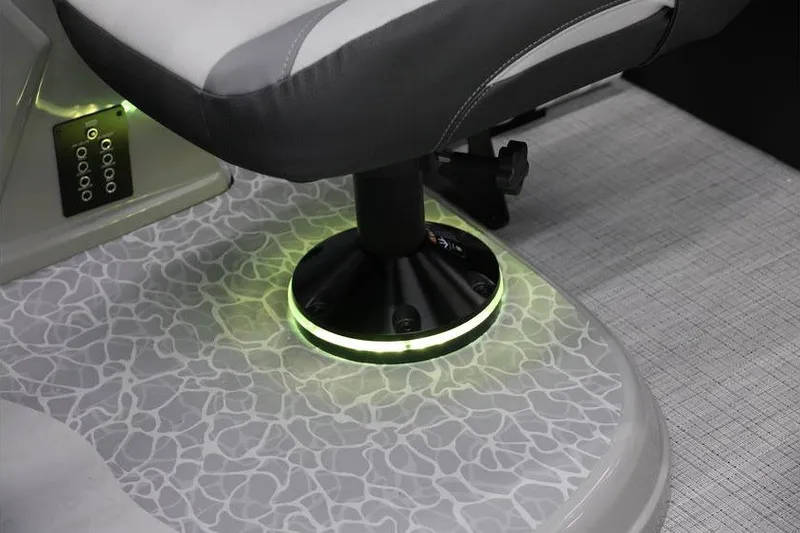 Slide: The Image of 2026 South Bay 224 RS 2.75 Hybrid Arch boat seat with illuminated base and textured flooring. - 14