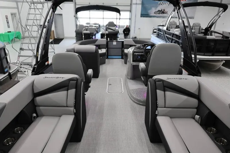 Slide: The Image of Interior of 2026 South Bay 224 RS 2.75 Hybrid Arch pontoon boat, showcasing seating and helm. - 8