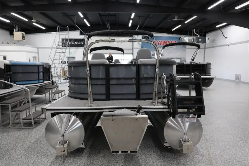 Slide: The Image of 2026 South Bay 224 RS 2.75 Hybrid Arch pontoon boat in showroom, rear view. - 5