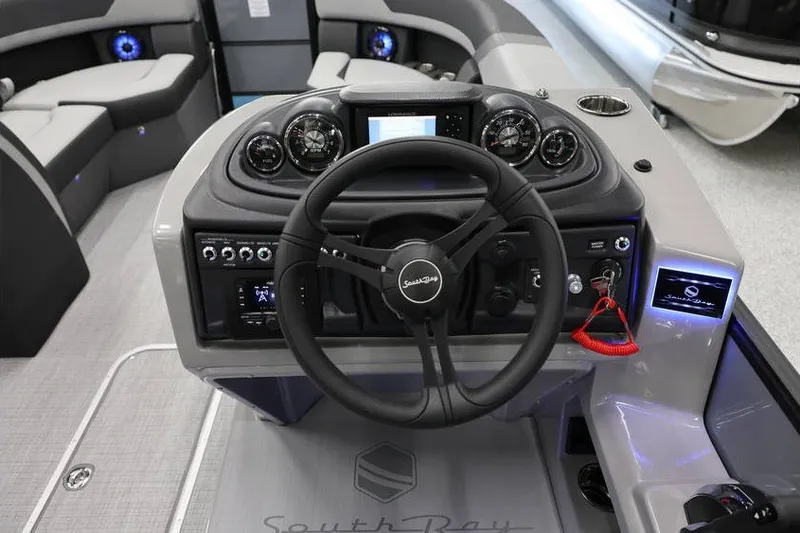 Slide: The Image of Steering console of 2026 South Bay 224 RS 2.75 Hybrid Arch boat, featuring modern controls. - 12