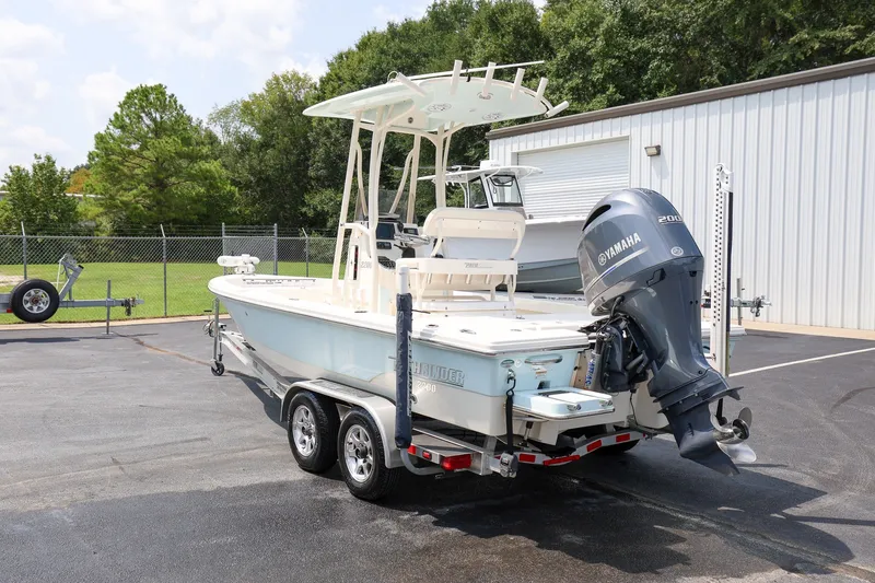 Slide: The Image of 2017 Pathfinder 2200 TRS boat with Yamaha engine on trailer, parked outdoors. - 4
