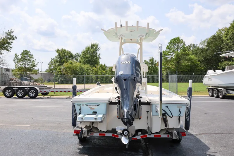 Slide: The Image of 2017 Pathfinder 2200 TRS boat with Yamaha 200 engine, parked outdoors. - 3