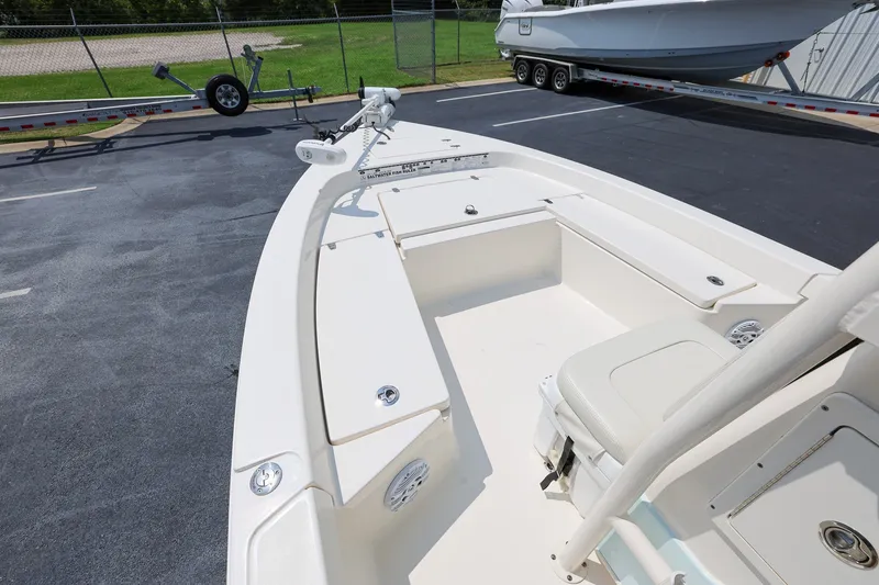 Slide: The Image of 2017 Pathfinder 2200 TRS boat interior with seating and storage compartments. - 13