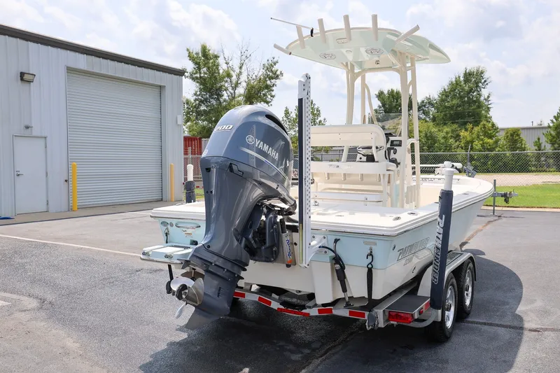 Slide: The Image of 2017 Pathfinder 2200 TRS boat with Yamaha engine on trailer, parked outdoors. - 2