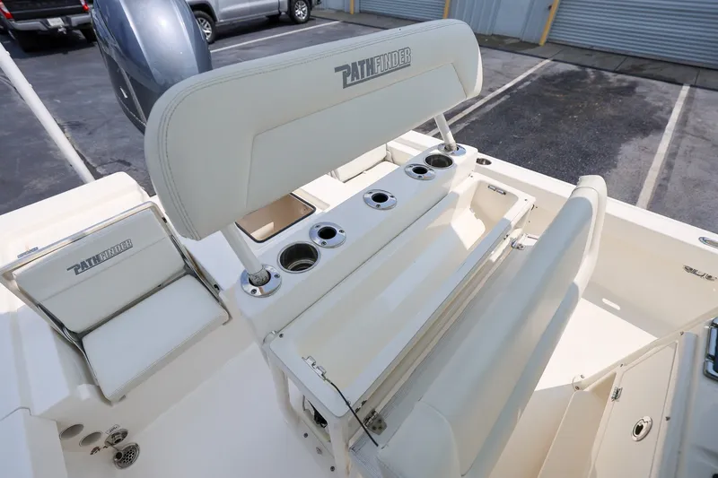 Slide: The Image of 2017 Pathfinder 2200 TRS boat interior with seating and cup holders. - 11