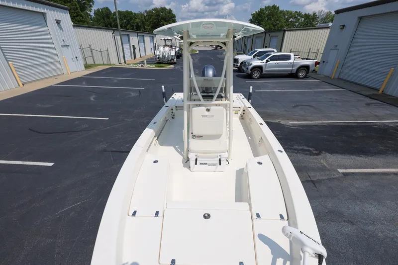 Slide: The Image of 2017 Pathfinder 2200 TRS boat parked in a lot with storage units. - 16