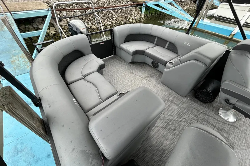 Slide: The Image of 2020 Bennington 23 SX pontoon boat with spacious gray seating and modern design. - 10