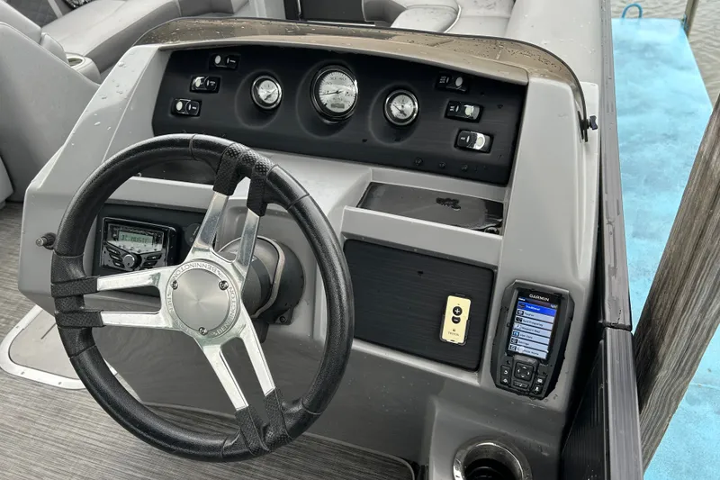 Slide: The Image of Steering console of a 2020 Bennington 23 SX boat with gauges and controls. - 7
