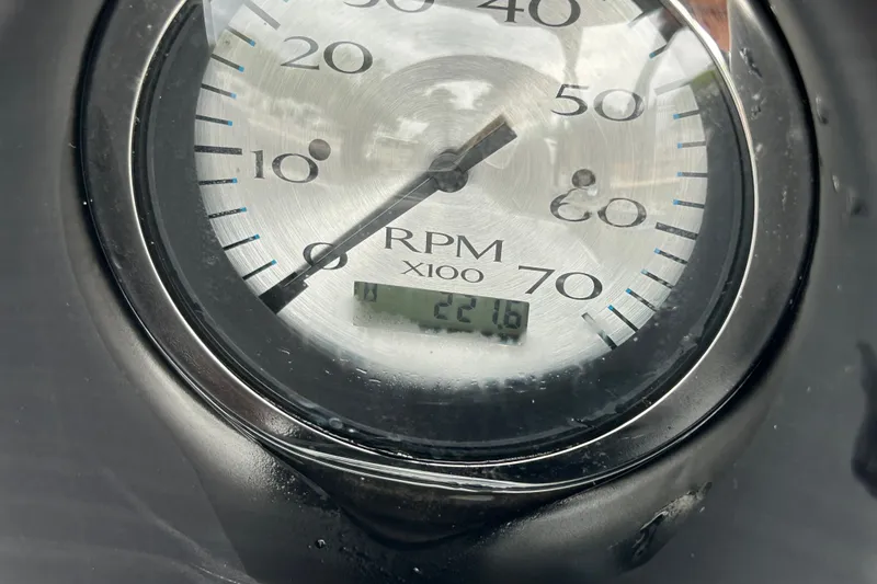 Slide: The Image of Close-up of a 2020 Bennington 23 SX RPM gauge displaying 2216 hours. - 8