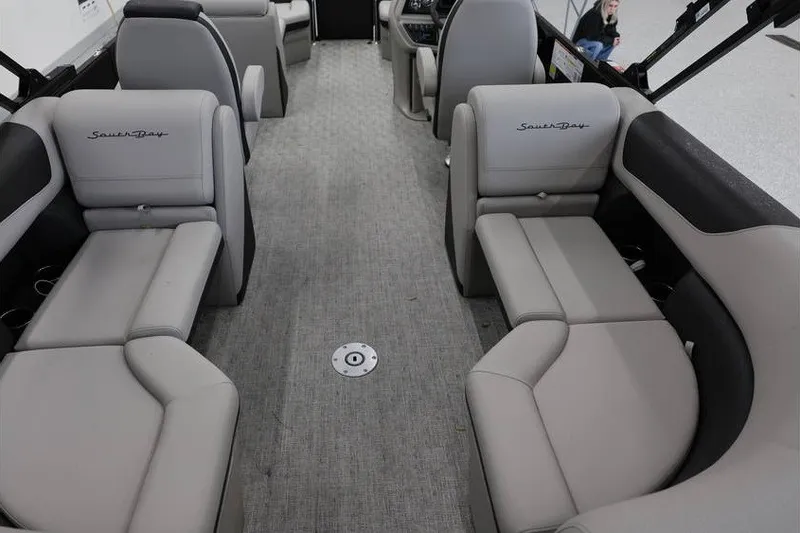 Slide: The Image of Interior of 2027 South Bay LE 224 RS 2.75 JAWS Edition pontoon boat, featuring plush seating. - 11