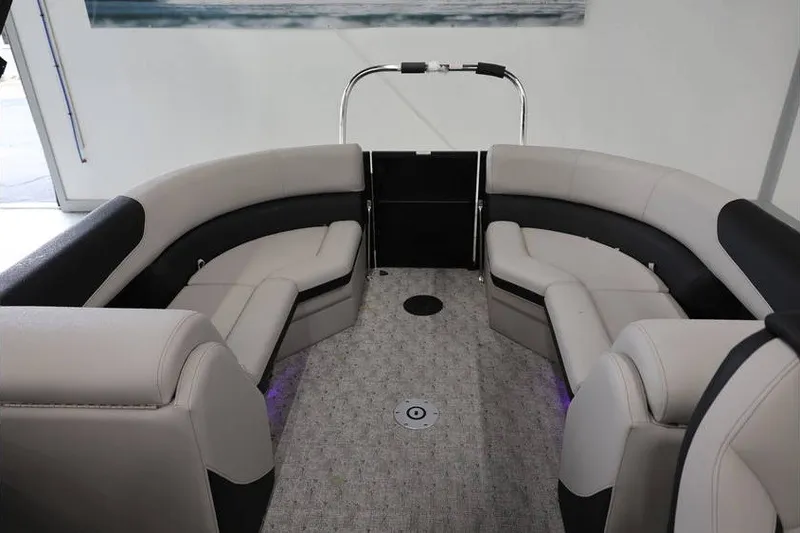 Slide: The Image of Interior of 2027 South Bay LE 224 RS 2.75 JAWS Edition pontoon boat with plush seating. - 12