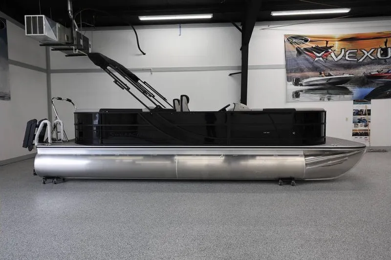 Slide: The Image of 2027 South Bay LE 224 RS 2.75 JAWS Edition pontoon boat in showroom. - 2