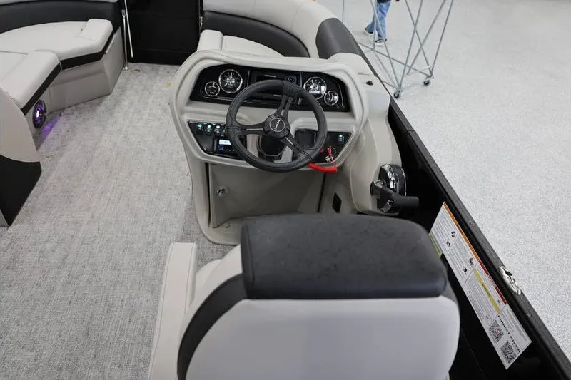 Slide: The Image of 2027 South Bay LE 224 RS 2.75 JAWS Edition boat interior with steering console. - 14