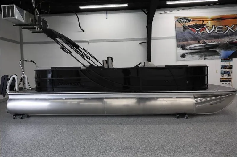 Slide: The Image of 2027 South Bay LE 224 RS 2.75 JAWS Edition pontoon boat in showroom. - 3