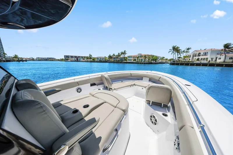 Slide: The Image of 2024 Sportsman Open 352 Center Console boat on serene blue water, luxury seating. - 30