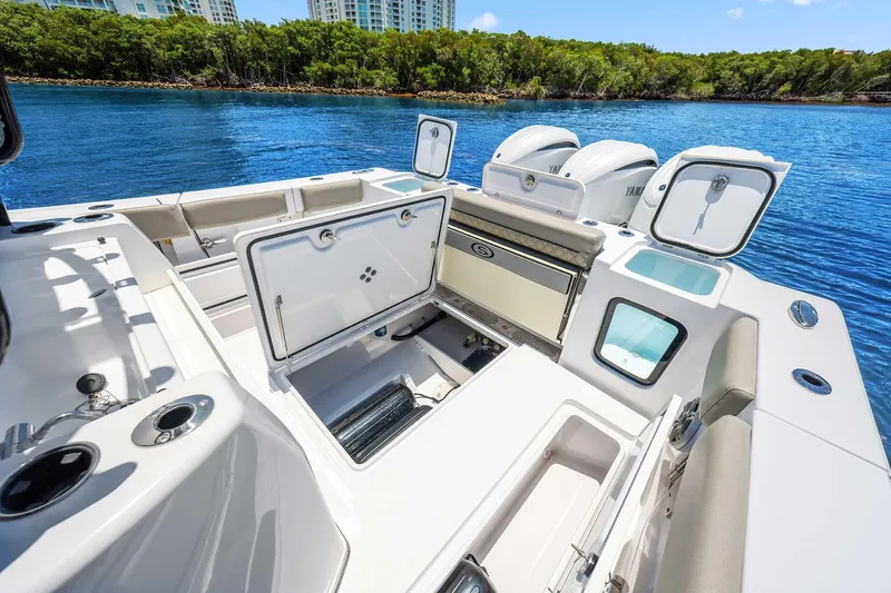 Slide: The Image of 2024 Sportsman Open 352 Center Console boat interior with open storage compartments. - 22