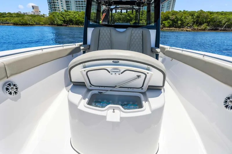 Slide: The Image of 2024 Sportsman Open 352 Center Console boat interior with seating and storage compartment. - 28