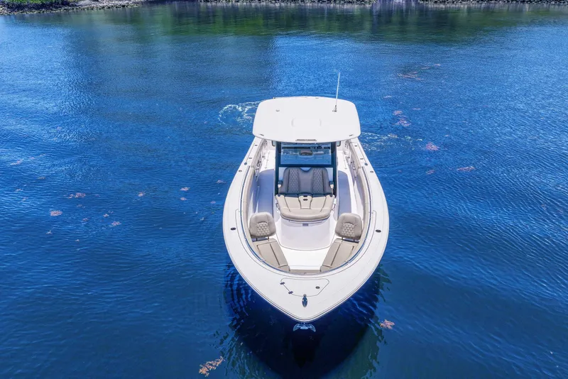 Slide: The Image of 2024 Sportsman Open 352 Center Console boat on calm blue water. - 9