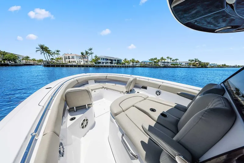 Slide: The Image of 2024 Sportsman Open 352 Center Console boat on a sunny waterfront. - 31