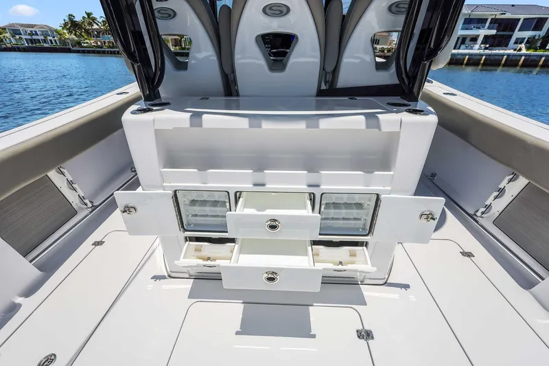 Slide: The Image of 2024 Sportsman Open 352 Center Console boat interior with open storage compartments. - 36