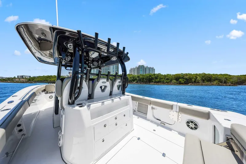 Slide: The Image of 2024 Sportsman Open 352 Center Console boat on water, featuring sleek design and spacious deck. - 18