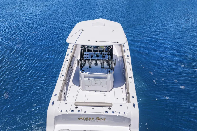 Slide: The Image of 2024 Sportsman Open 352 Center Console boat on blue water, aerial view. - 12