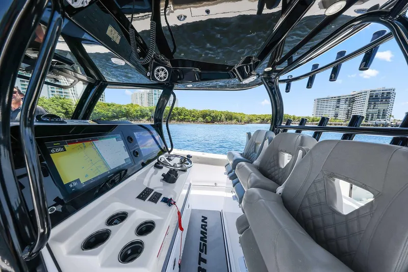 Slide: The Image of 2024 Sportsman Open 352 Center Console interior with modern navigation system and luxurious seating. - 21
