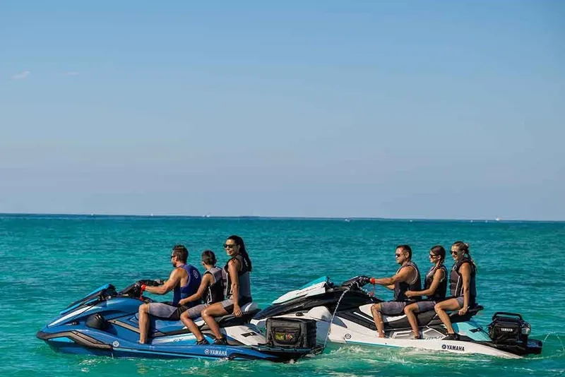 Slide: The Image of People enjoying a ride on 2021 Yamaha WaveRunner FX Cruiser HO jet skis in clear blue water. - 6