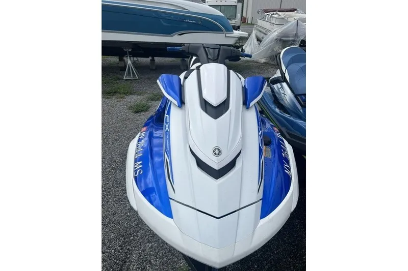The Image of 2021 Yamaha WaveRunner FX Cruiser HO in blue and white, parked outdoors. - 0
