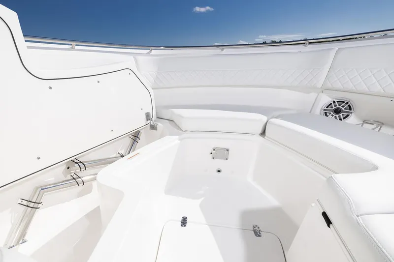 Slide: The Image of Manufacturer Provided Image: Spacious interior of 2025 Pursuit DC 326 Dual Console boat under clear blue sky. - 17