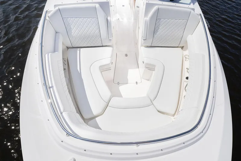Slide: The Image of Manufacturer Provided Image: 2025 Pursuit DC 326 Dual Console boat with spacious white seating area. - 6