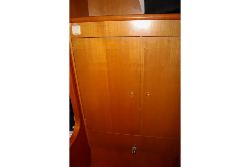 Slide: The Image of Wooden cabinet interior of 2001 Lagoon 410 catamaran. - 37