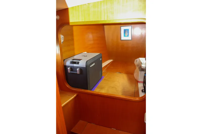 Slide: The Image of Interior of 2001 Lagoon 410 yacht with wooden finish and compact appliance. - 36