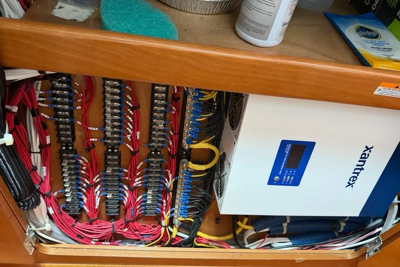Slide: The Image of Electrical panel and Xantrex inverter in a 2001 Lagoon 410 boat. - 68