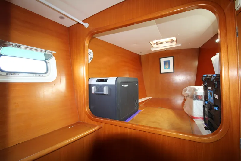 Slide: The Image of Interior of 2001 Lagoon 410 yacht with wooden paneling and modern equipment. - 40