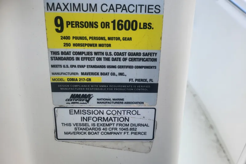 Slide: The Image of Capacity label on 2012 Cobia 217 Center Console, 9 persons or 1600 lbs, 250 HP motor. - 34