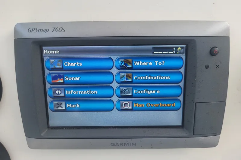 Slide: The Image of Garmin GPSmap 740s display on 2012 Cobia 217 Center Console boat, showing navigation options. - 20