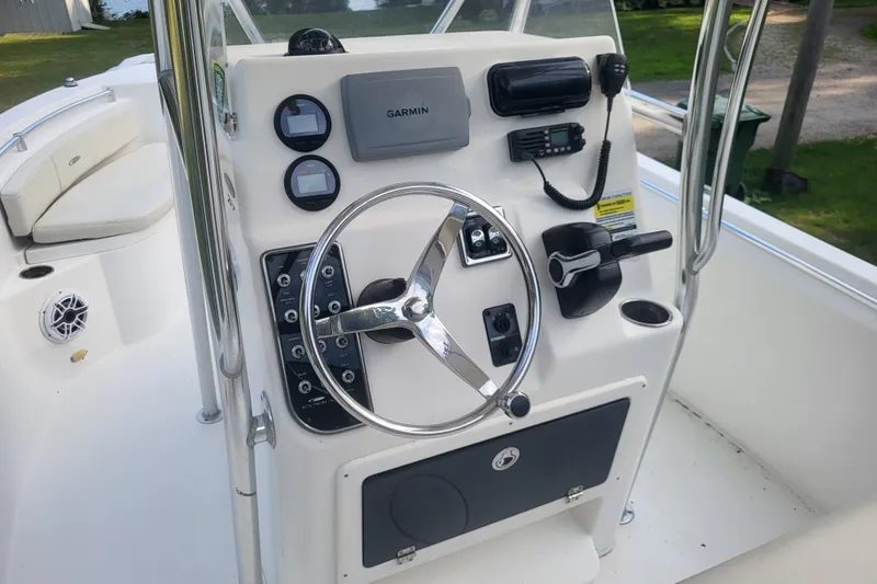 Slide: The Image of 2012 Cobia 217 Center Console boat dashboard with Garmin navigation system. - 15