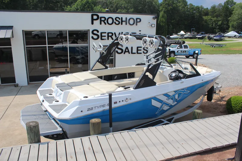 Slide: The Image of 2022 ATX Surf Boats 22 Type-S displayed at a pro shop, ready for sale. - 1