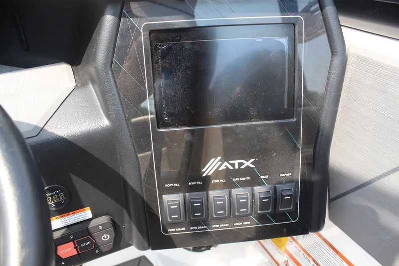 Slide: The Image of 2022 ATX Surf Boats 22 Type-S dashboard with control panel and display screen. - 17