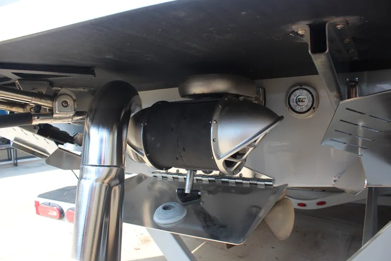 Slide: The Image of 2022 ATX Surf Boats 22 Type-S underside showing exhaust and mechanical components. - 10
