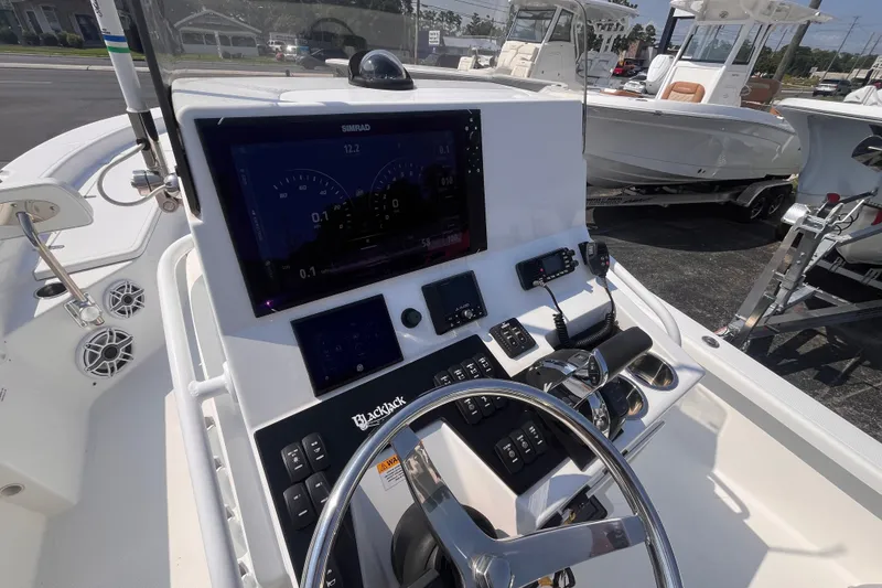 Slide: The Image of 2023 BlackJack 256 Bay boat dashboard with advanced controls and navigation system. - 16