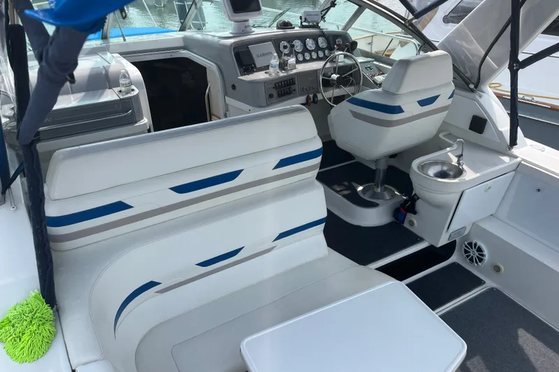 Slide: The Image of 1997 Formula 34 Performance Cruiser interior with seating, helm, and sink. - 20