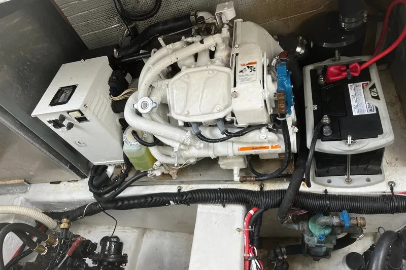 Slide: The Image of Engine compartment of a 1997 Formula 34 Performance Cruiser, showcasing mechanical components. - 33