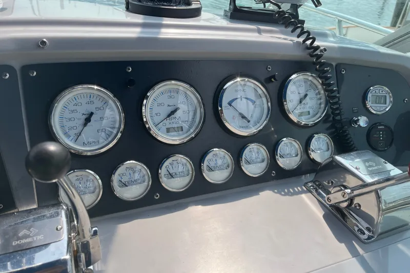 Slide: The Image of Dashboard of a 1997 Formula 34 Performance Cruiser with gauges and controls. - 15