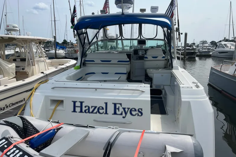 Slide: The Image of 1997 Formula 34 Performance Cruiser named "Hazel Eyes" docked at a marina. - 19